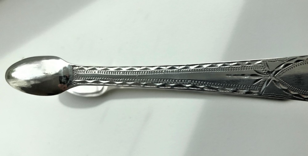 A desirable pair of Georgian Newcastle silver tongs View VI
