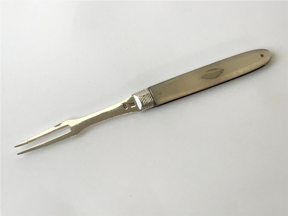 A late 18th Century silver folding fruit fork View V