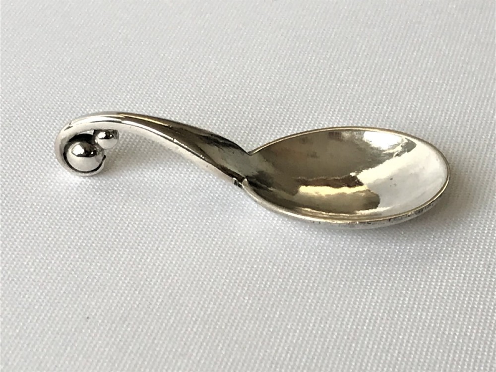 An extremely rare Georg Jensen tiny silver apothecary spoon