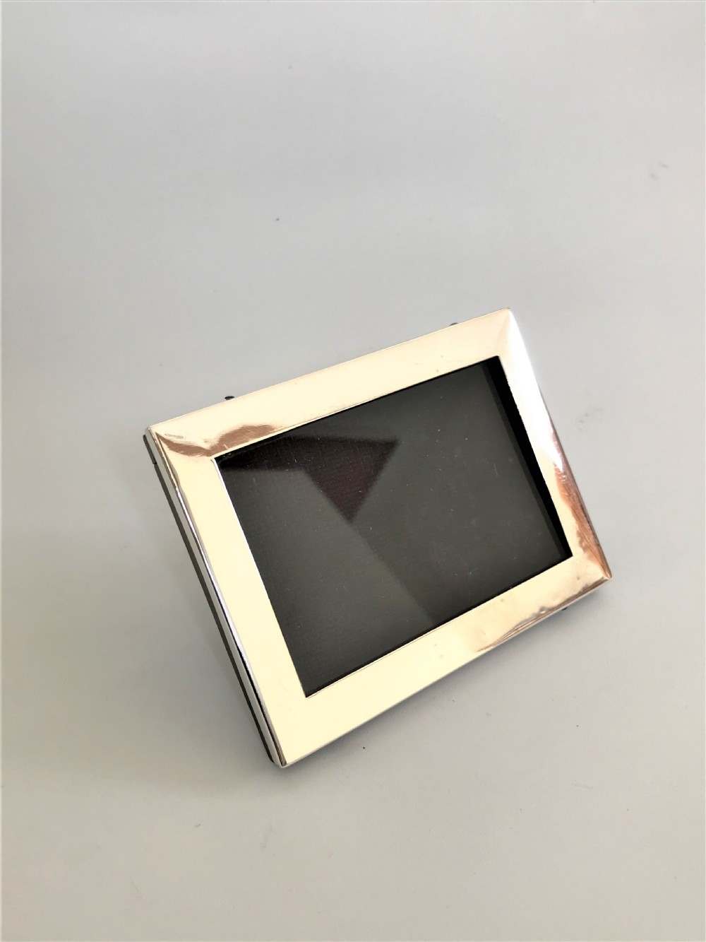 A small silver landscape/portrait photo frame