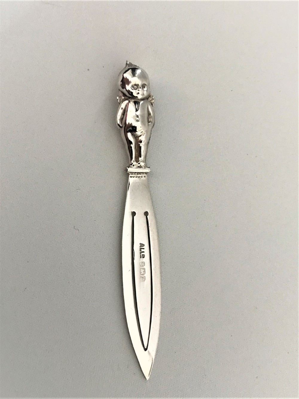 A rare silver 'thumbs up' good luck bookmark