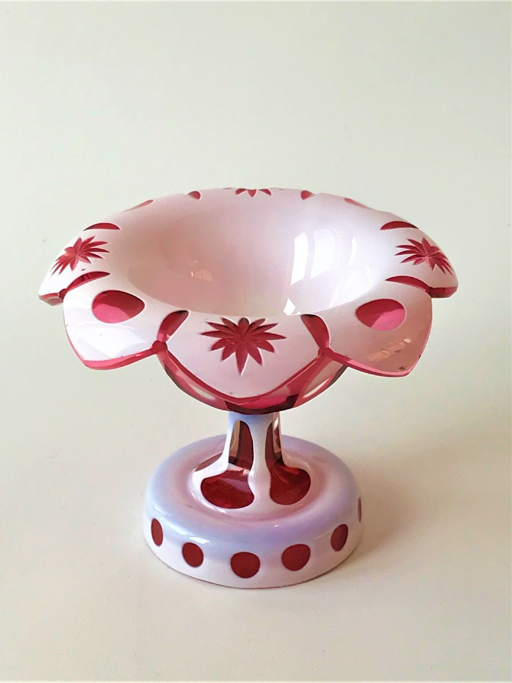 A Bohemian overlay cranberry condiment dish
