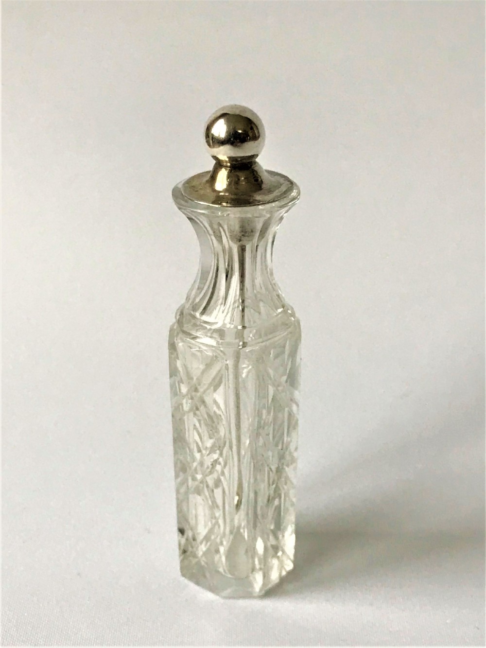 A rare Victorian silver mounted cayenne bottle