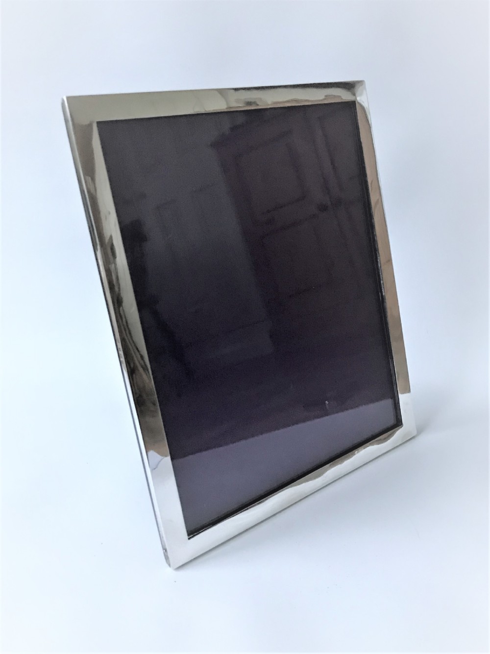 A large rectangular silver photo frame