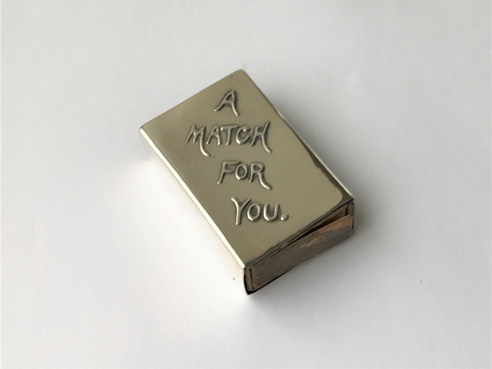 An Edwardian novelty silver 'motto' match box case
