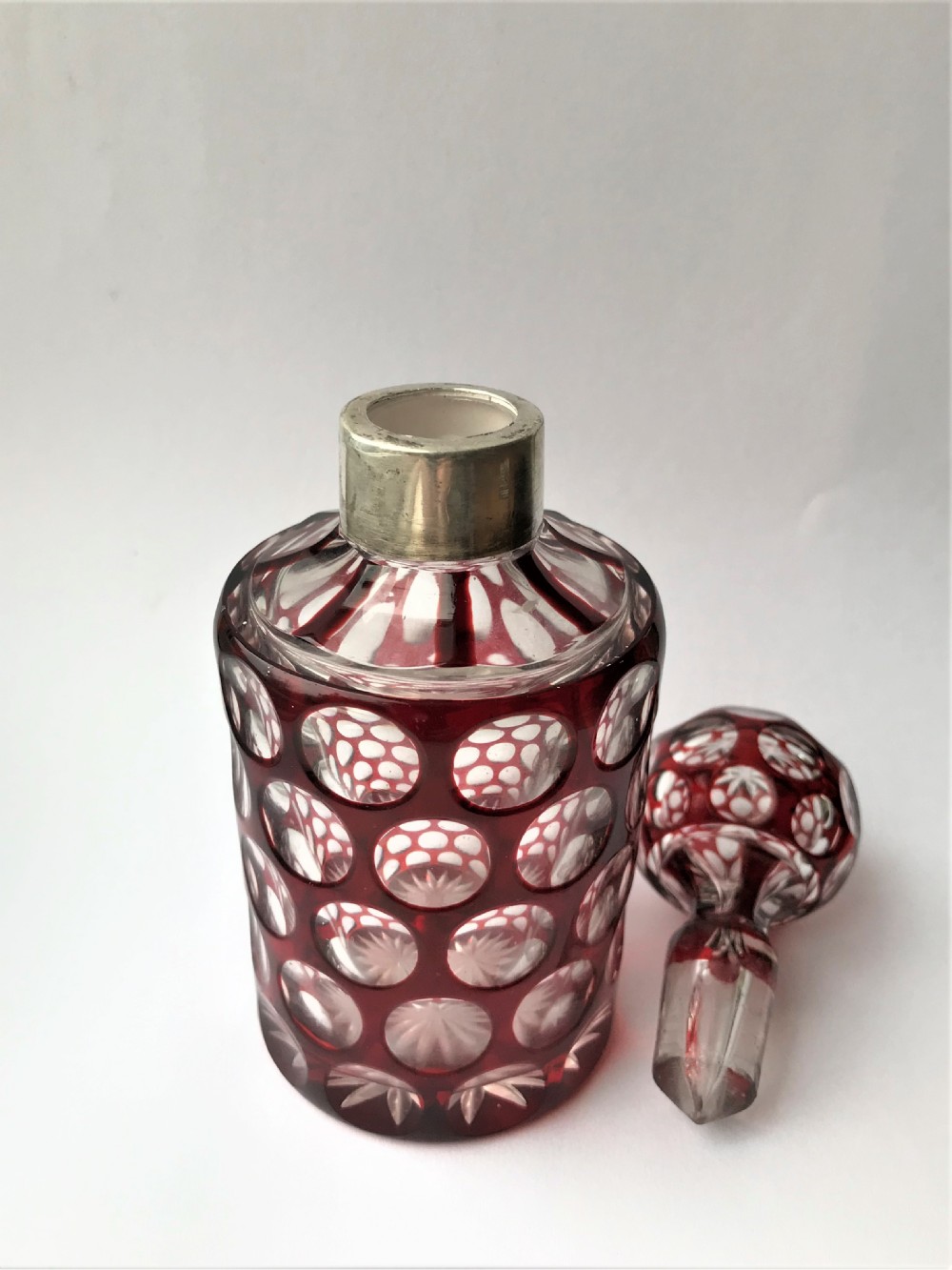 A gorgeous silver mounted ruby glass cologne bottle View III