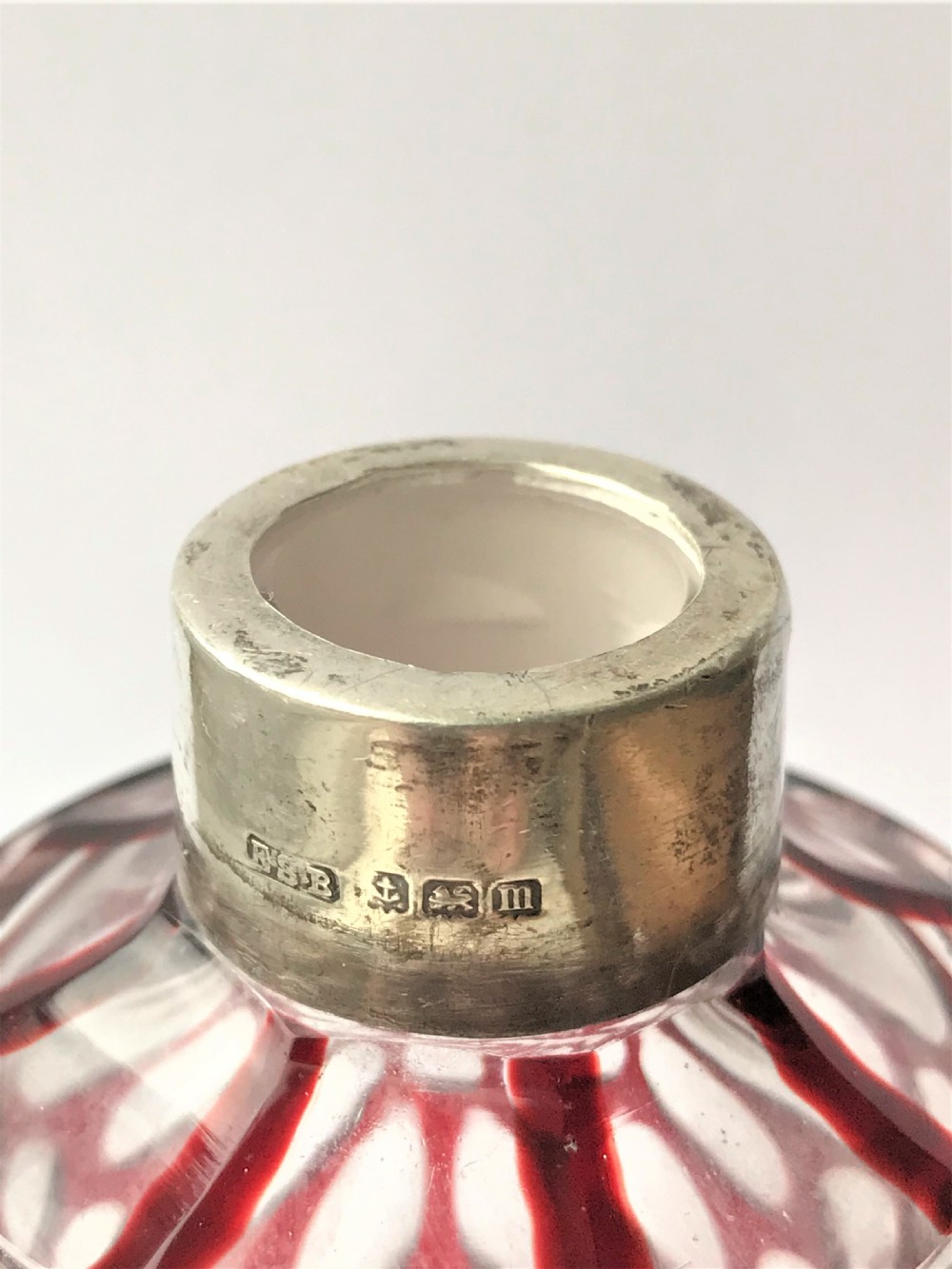 A gorgeous silver mounted ruby glass cologne bottle View IV