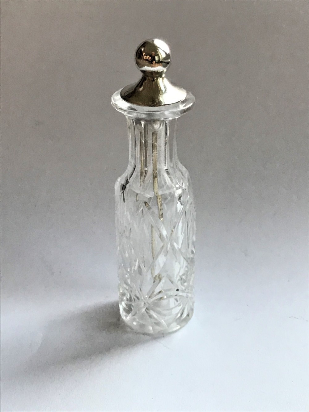 A rare Victorian silver mounted cayenne pepper bottle & spoon
