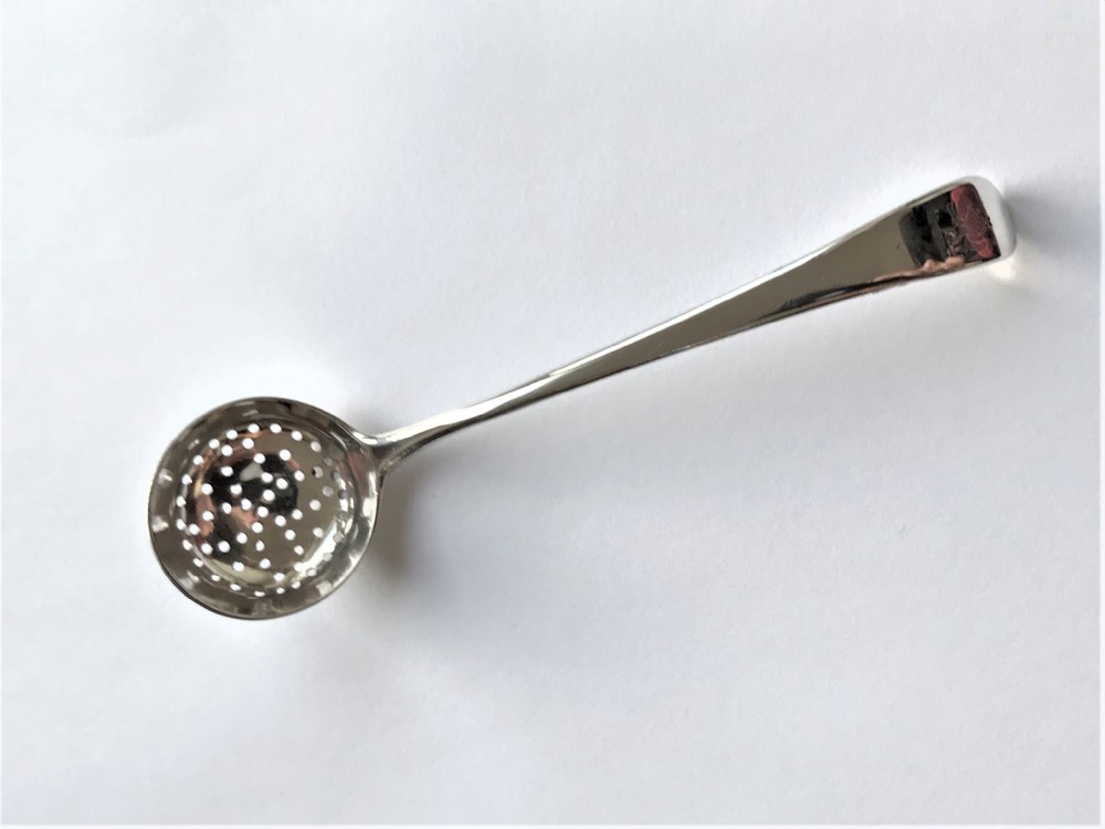A rare 18th Century silver spice sifting ladle View V