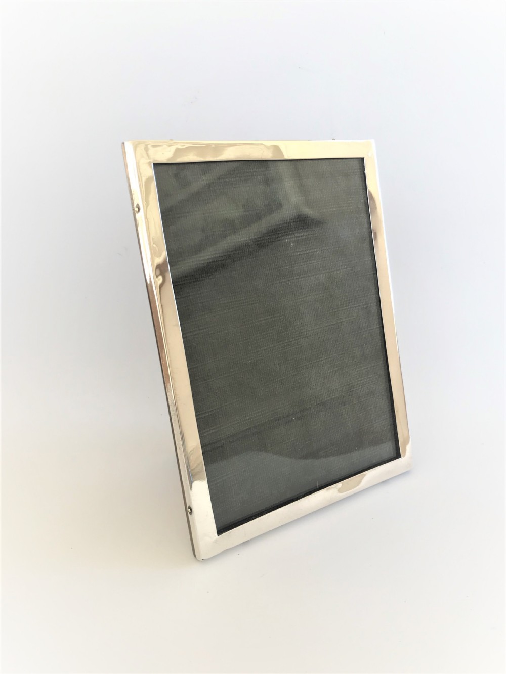 An elegant George V silver photo frame