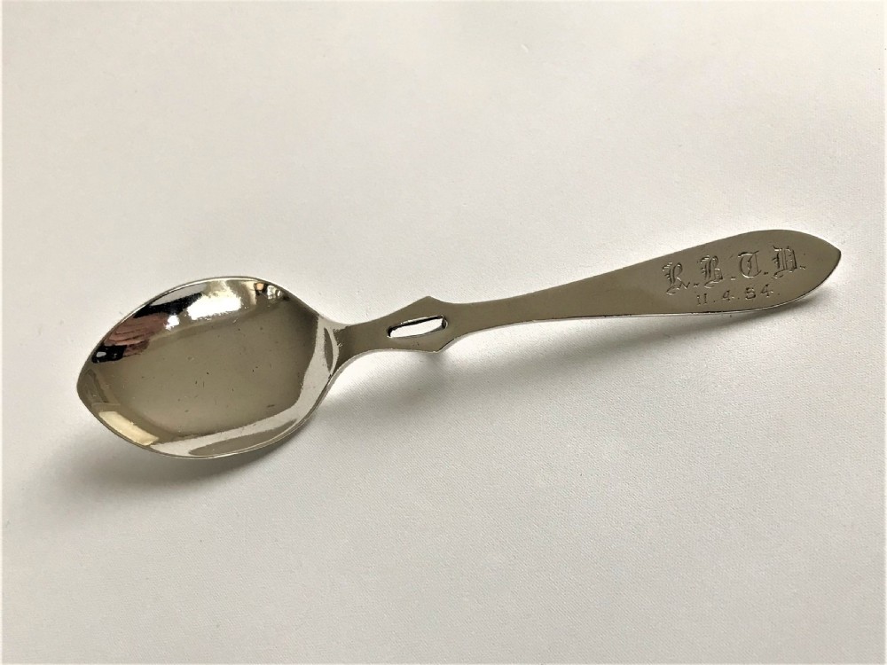A Coronation hallmark silver honey spoon