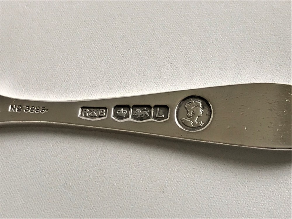 A Coronation hallmark silver honey spoon View III