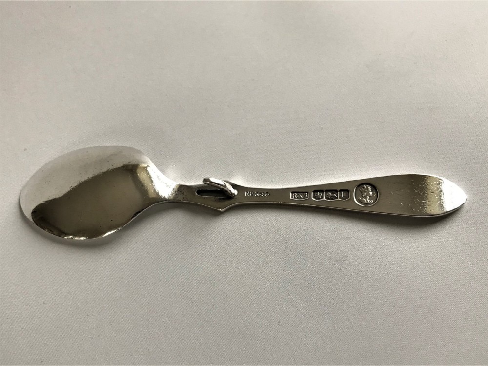A Coronation hallmark silver honey spoon View IV