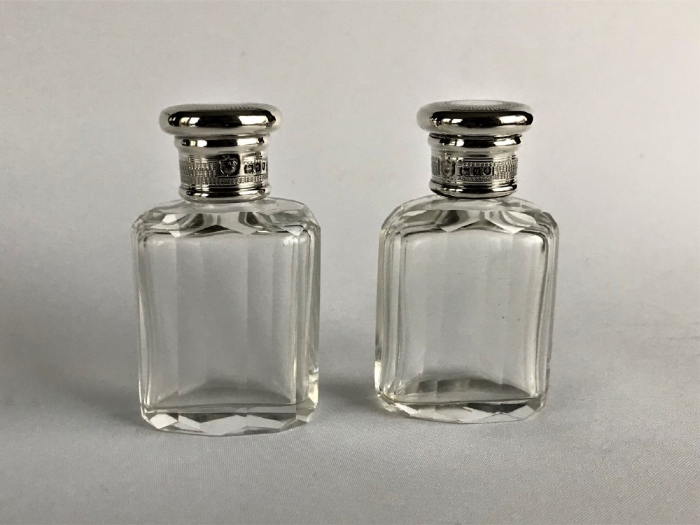 A delightful pair of silver mounted small toilet water bottles