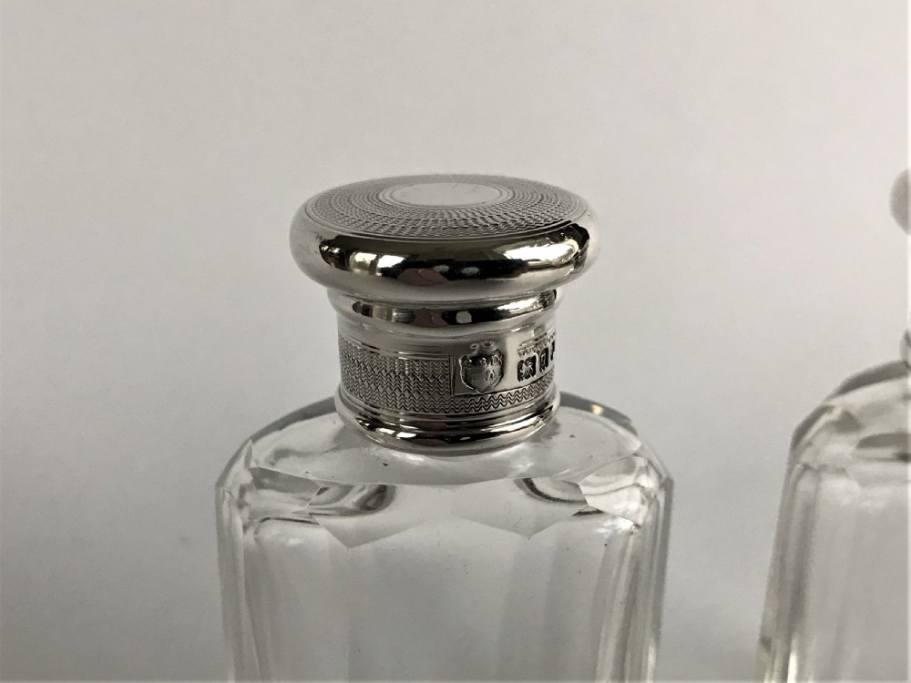 A delightful pair of silver mounted small toilet water bottles View V