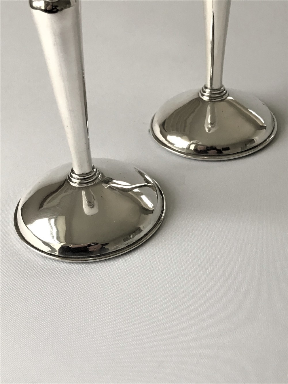 A stylish pair of Coronation mark silver candle sticks View II