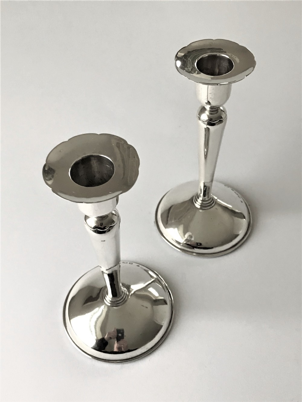 A stylish pair of Coronation mark silver candle sticks View III