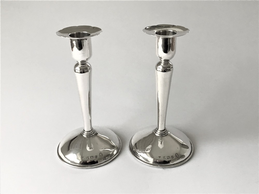 A stylish pair of Coronation mark silver candle sticks View IV
