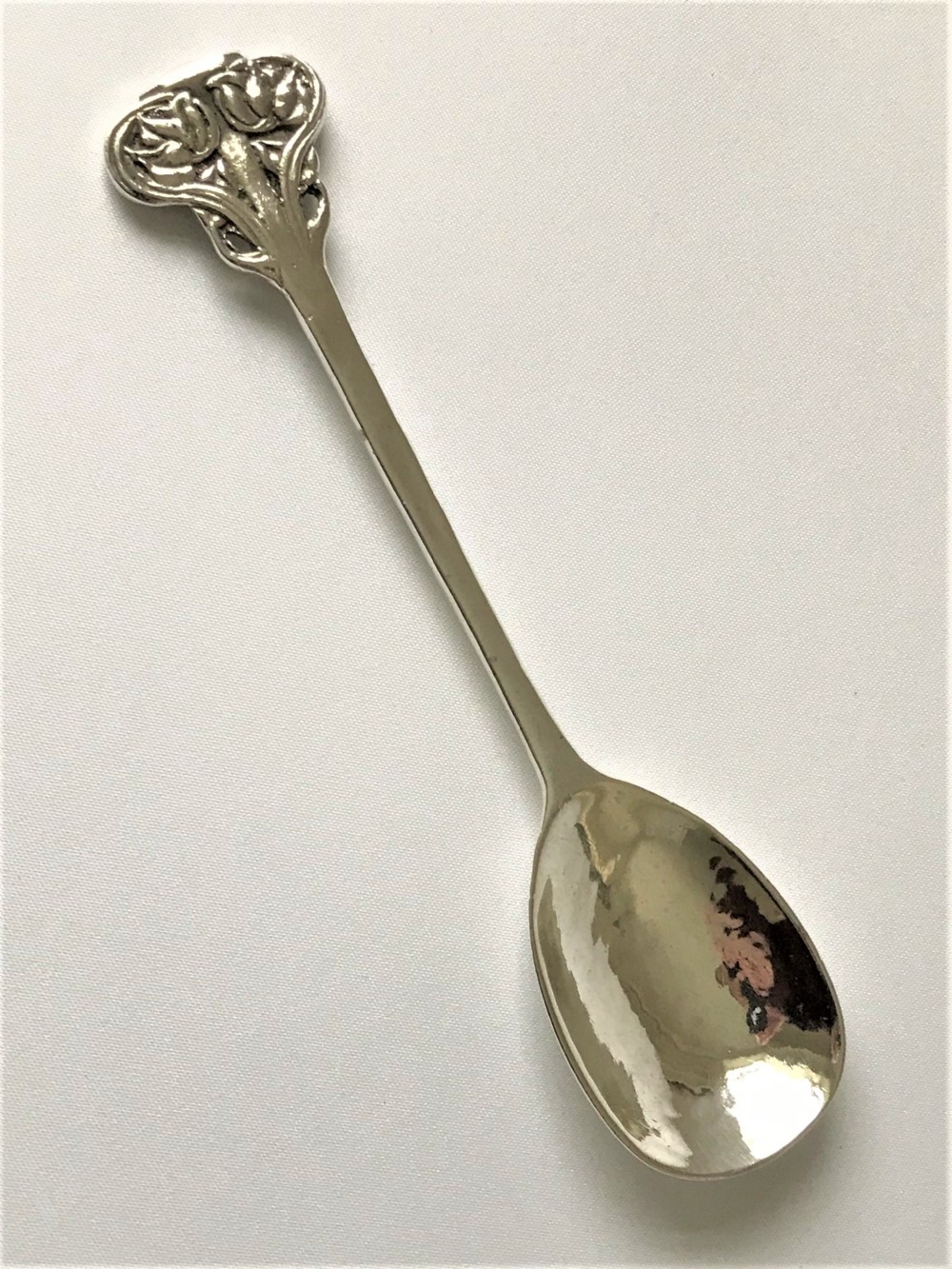 An exceptional Ramsden & Carr Arts & Crafts silver spoon