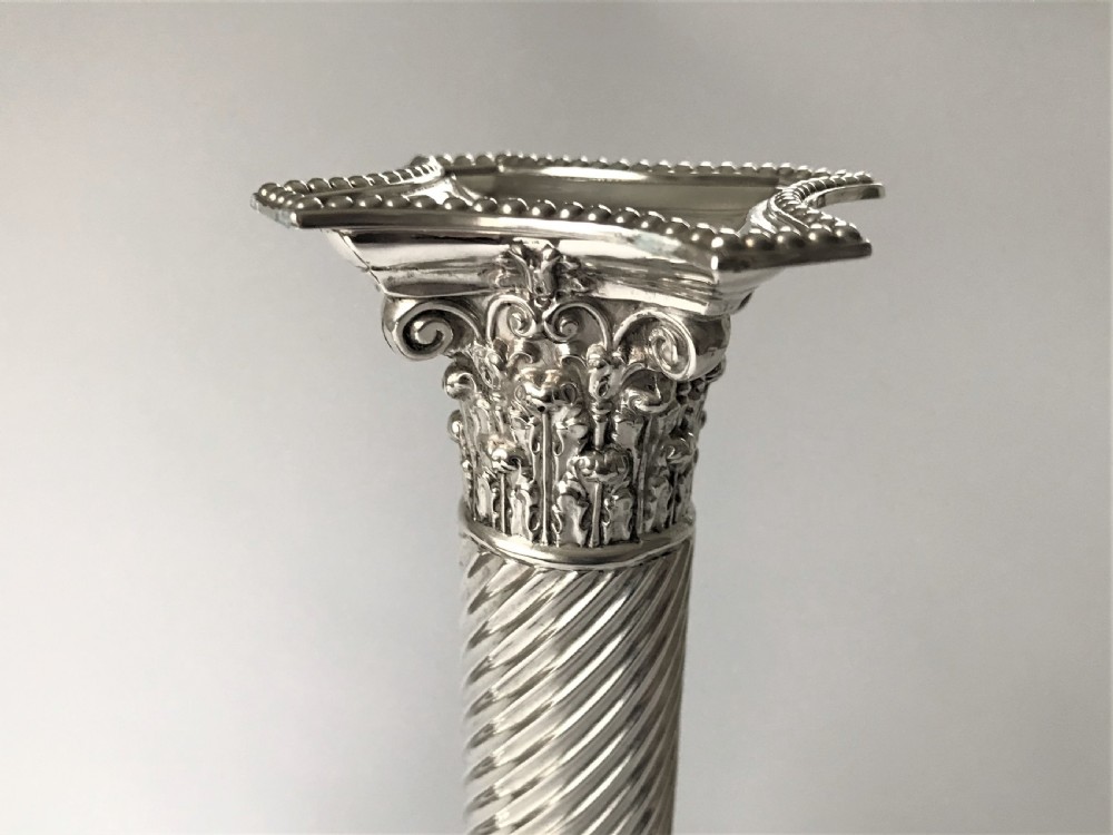 A fabulous pair of Victorian silver candlesticks View III