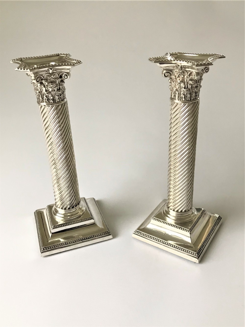 A fabulous pair of Victorian silver candlesticks View V