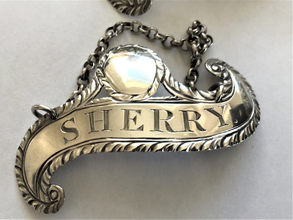 Three rare Hester Bateman silver wine labels View II