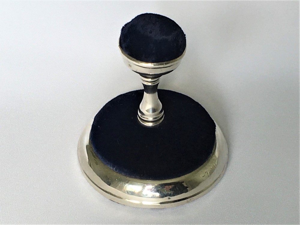 An unusual Edwardian silver 'fountain' double pin cushion