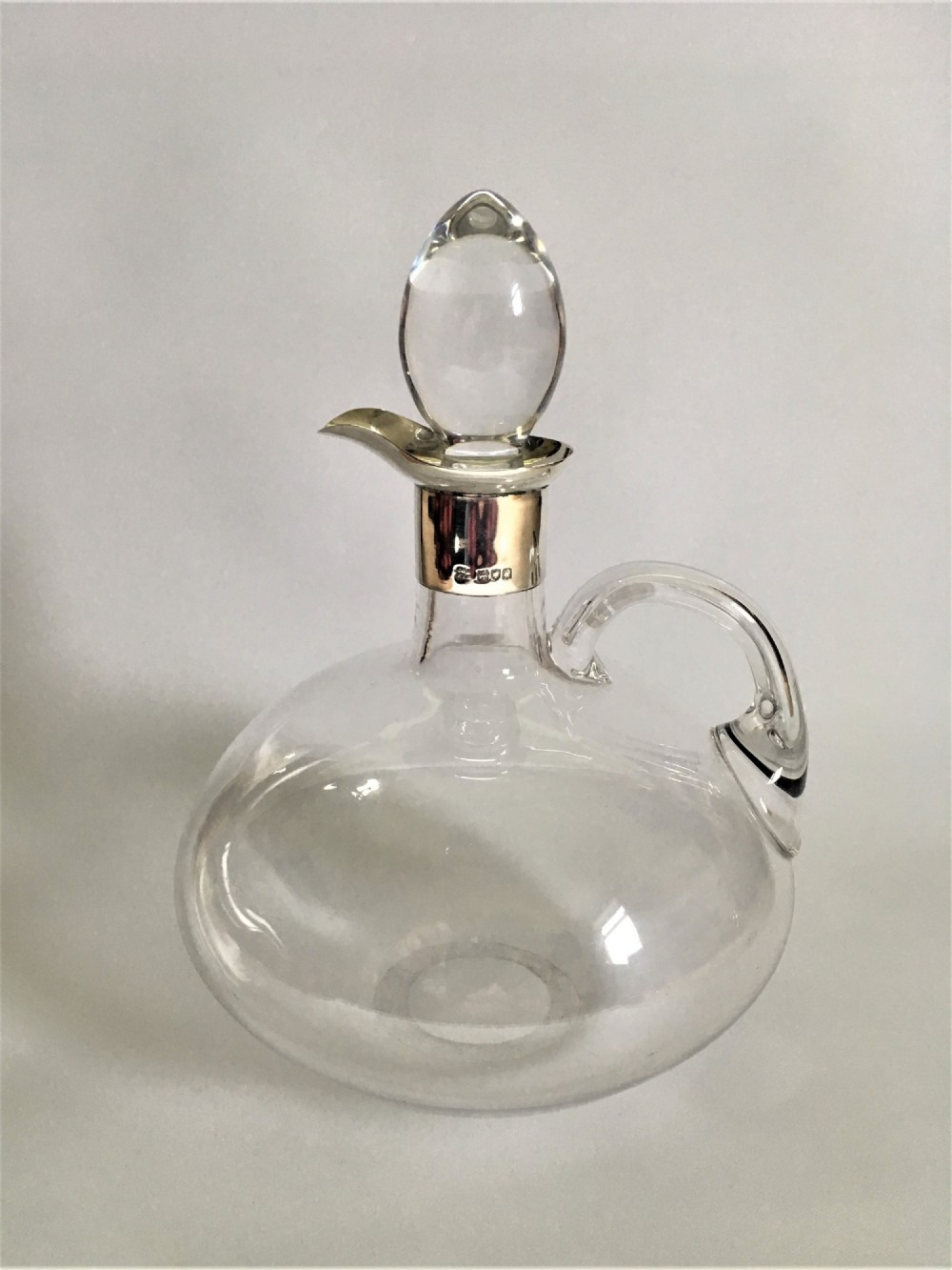 A handsome Victorian silver mounted flagon decanter