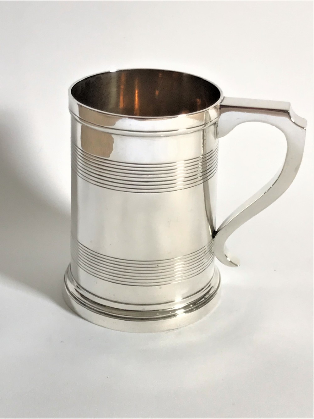 A magnificent Georgian revival silver pint tankard