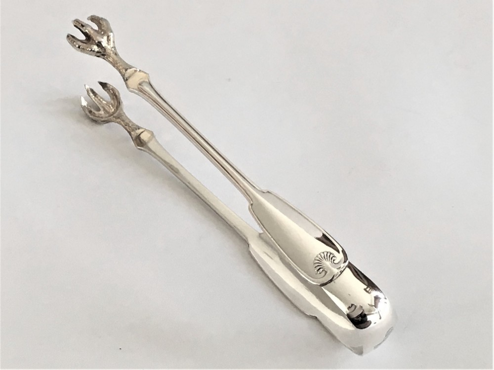 A fabulous pair of 19th Century Tiffany silver tongs