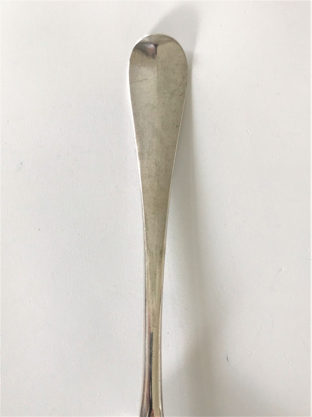 A handsome George II silver fancy back serving spoon View II