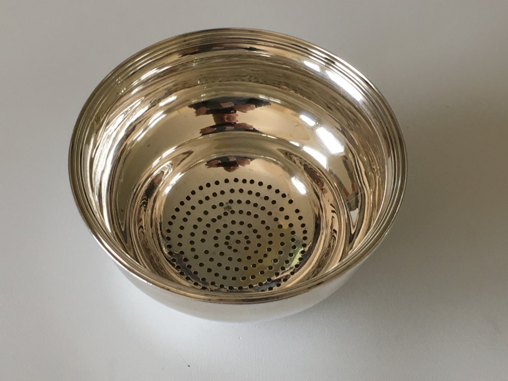 A handsome late 18th Century silver strainer