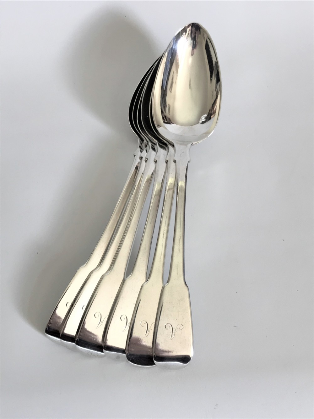A fine set of 6 Georgian silver table/serving spoons