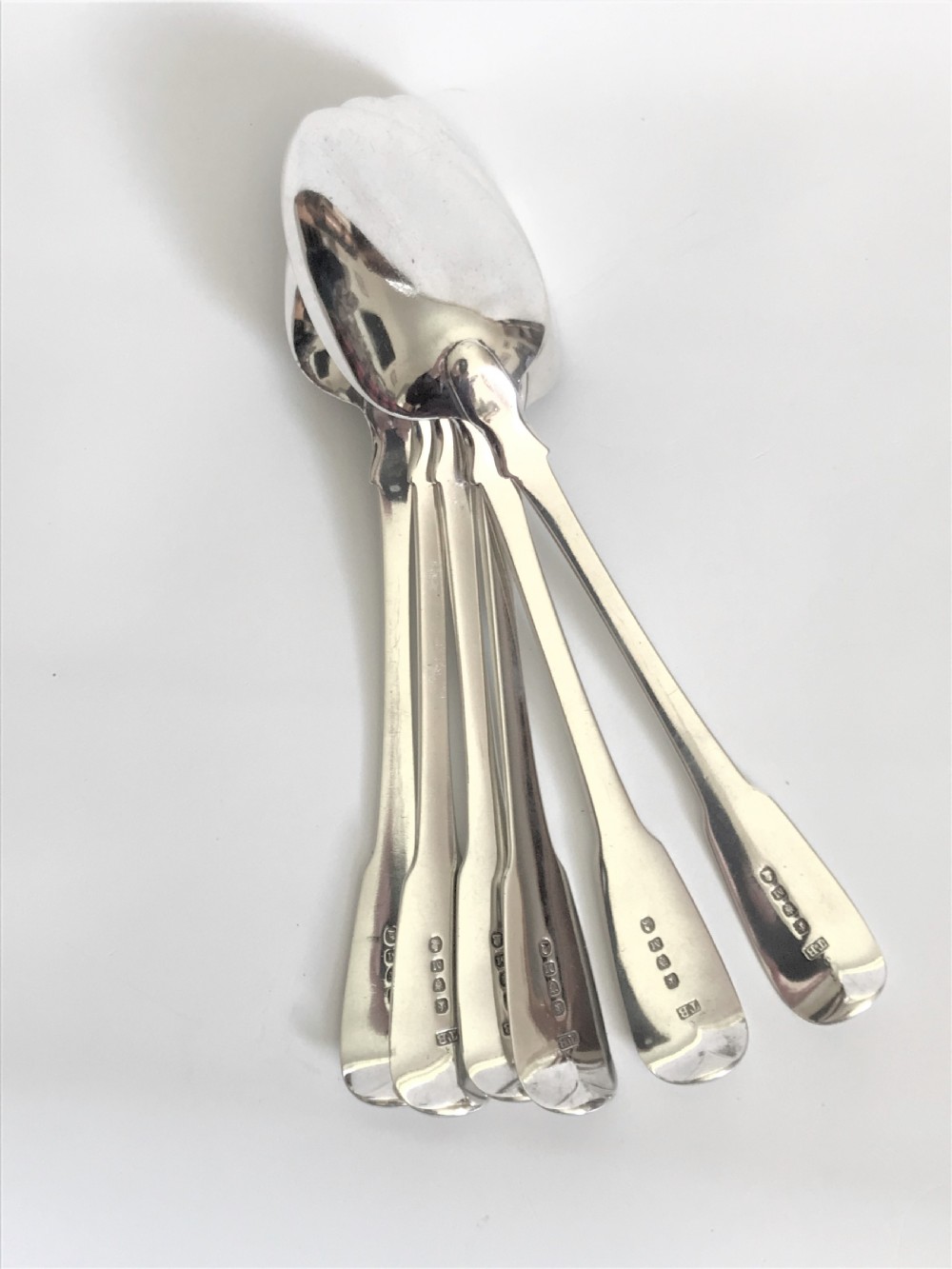 A fine set of 6 Georgian silver table/serving spoons View II