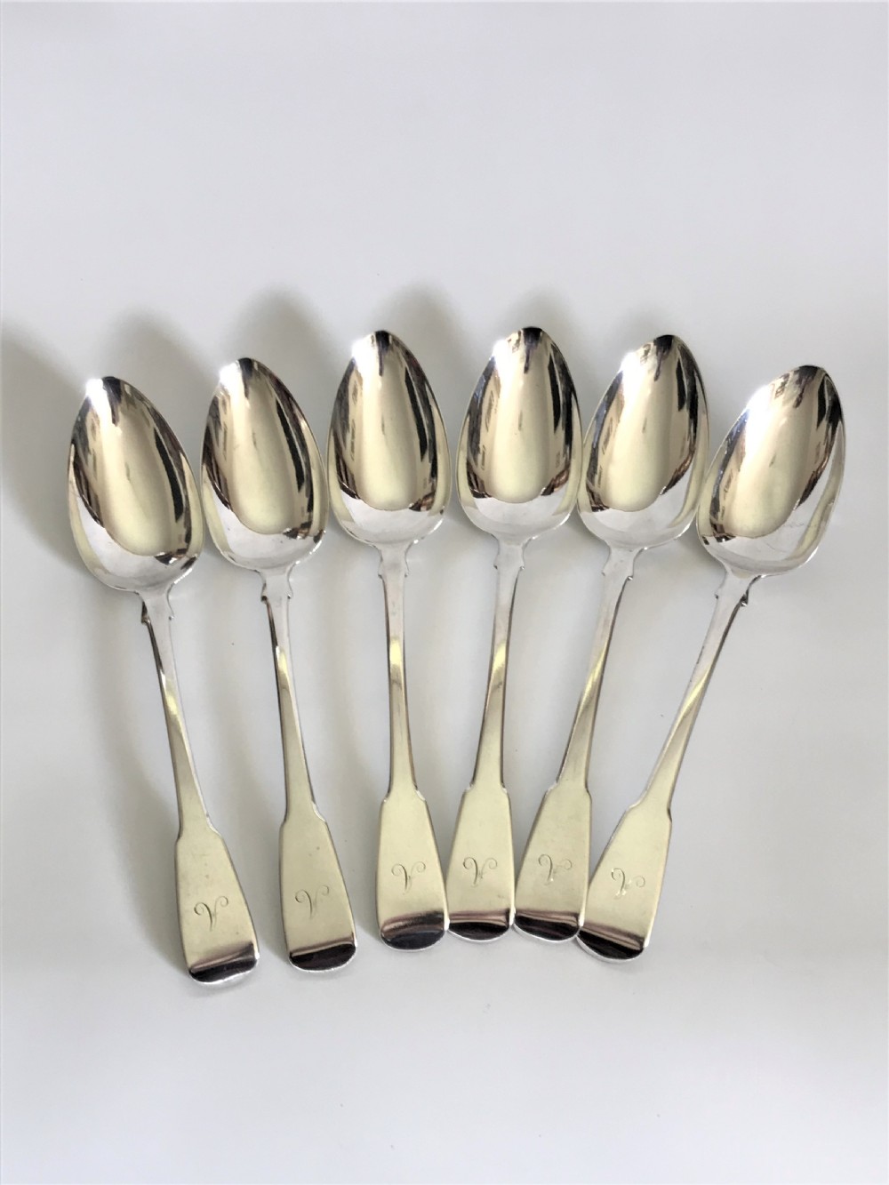 A fine set of 6 Georgian silver table/serving spoons View III