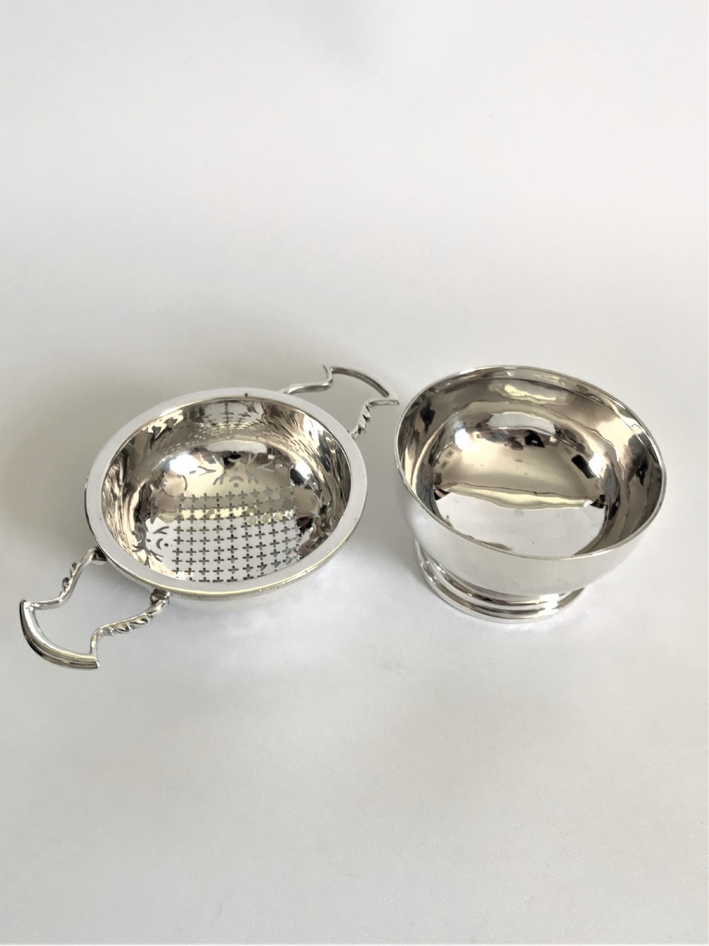 A superb silver tea strainer & drip cup View II