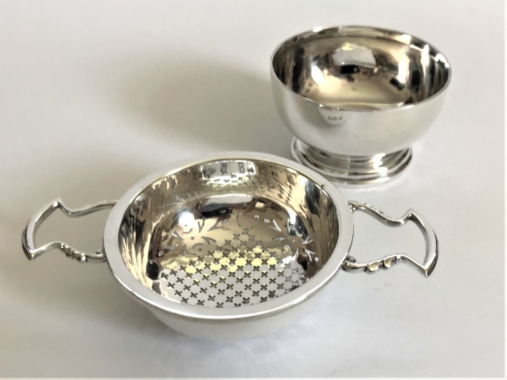 A superb silver tea strainer & drip cup View III