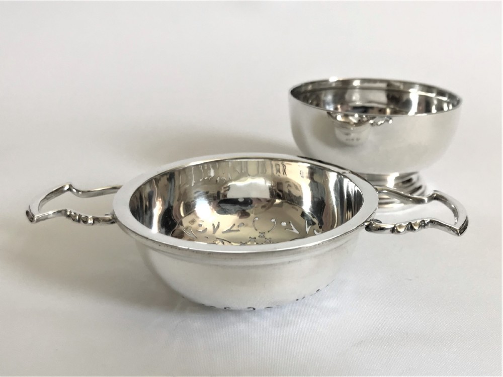 A superb silver tea strainer & drip cup View IV
