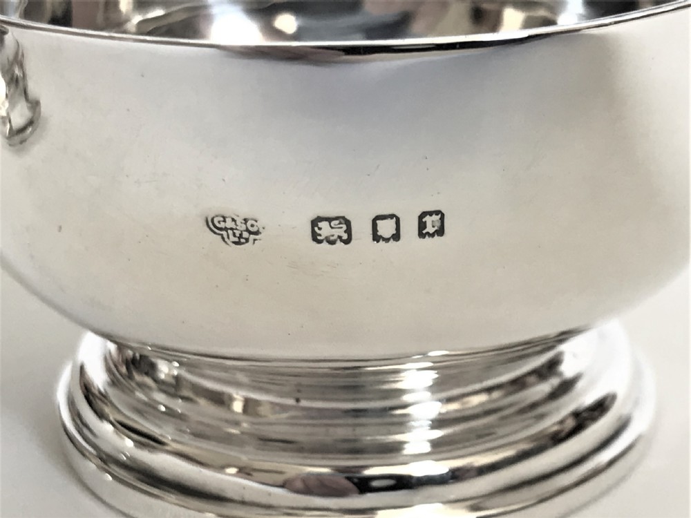 A superb silver tea strainer & drip cup View VII
