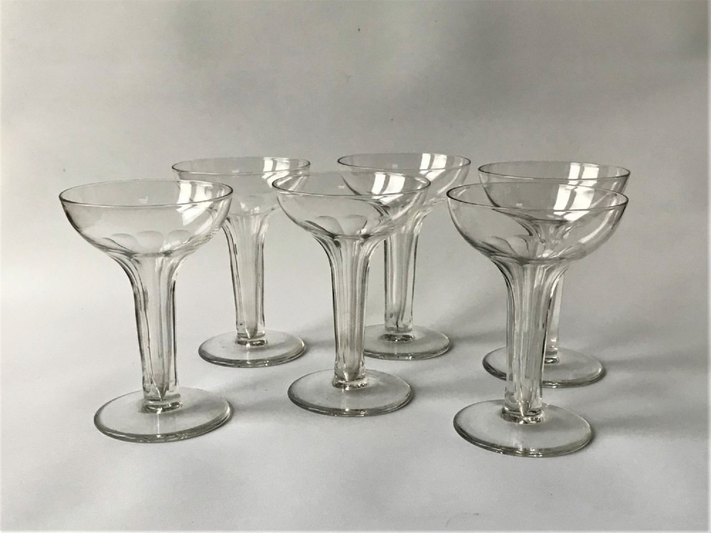 A Set Of Six Small Hollow Stem Champagne Glasses