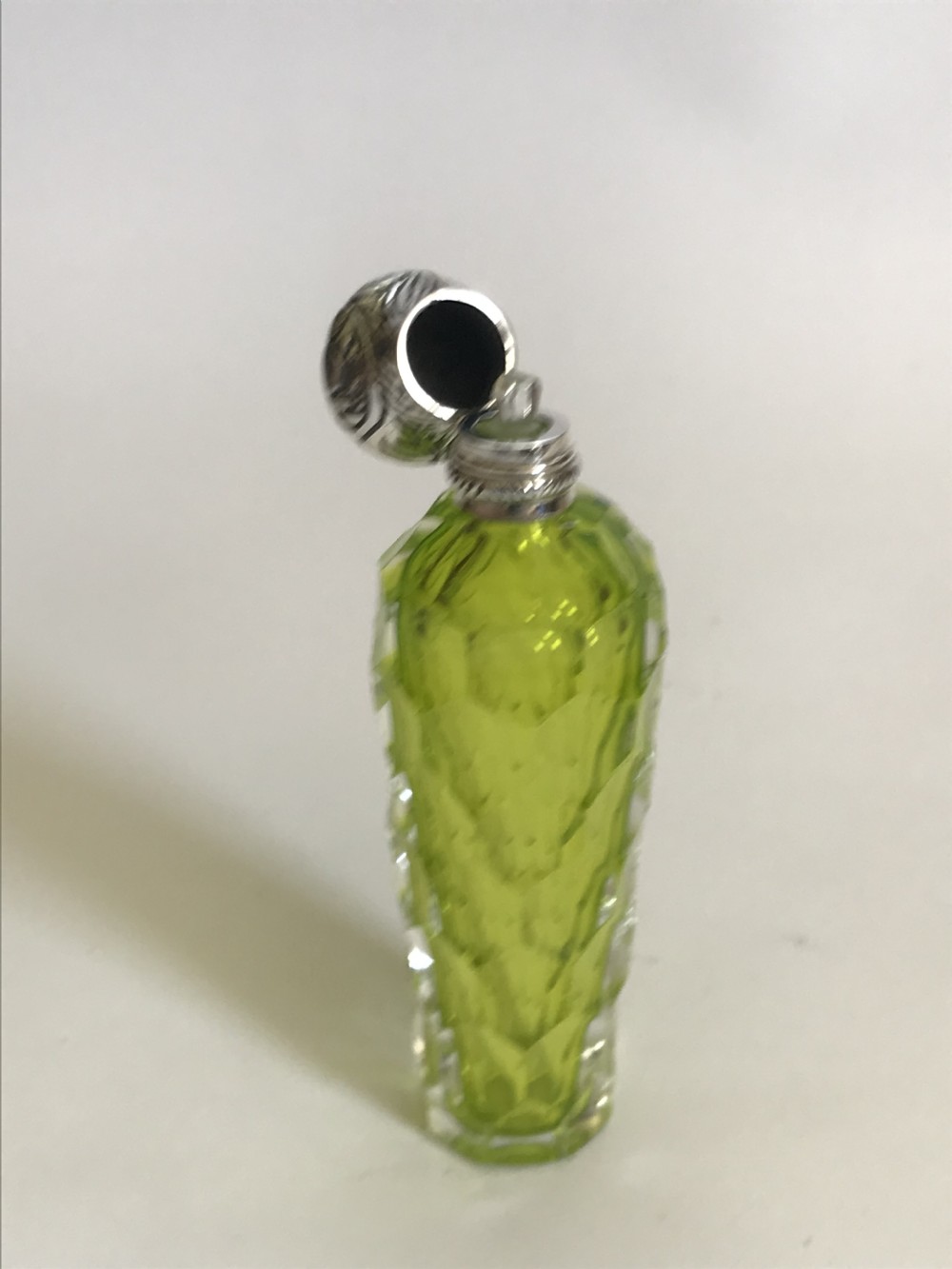 A gorgeous acid green Victorian silver mounted scent bottle View III