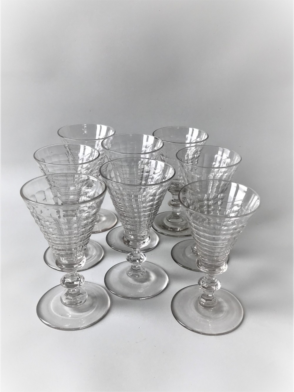An unusual set of 8 Victorian quilt cut wine glasses