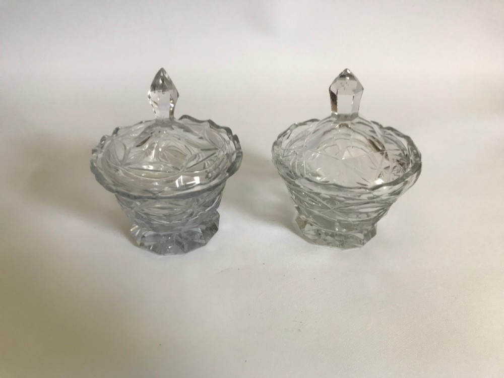 A superb pair of Georgian lidded condiment pots