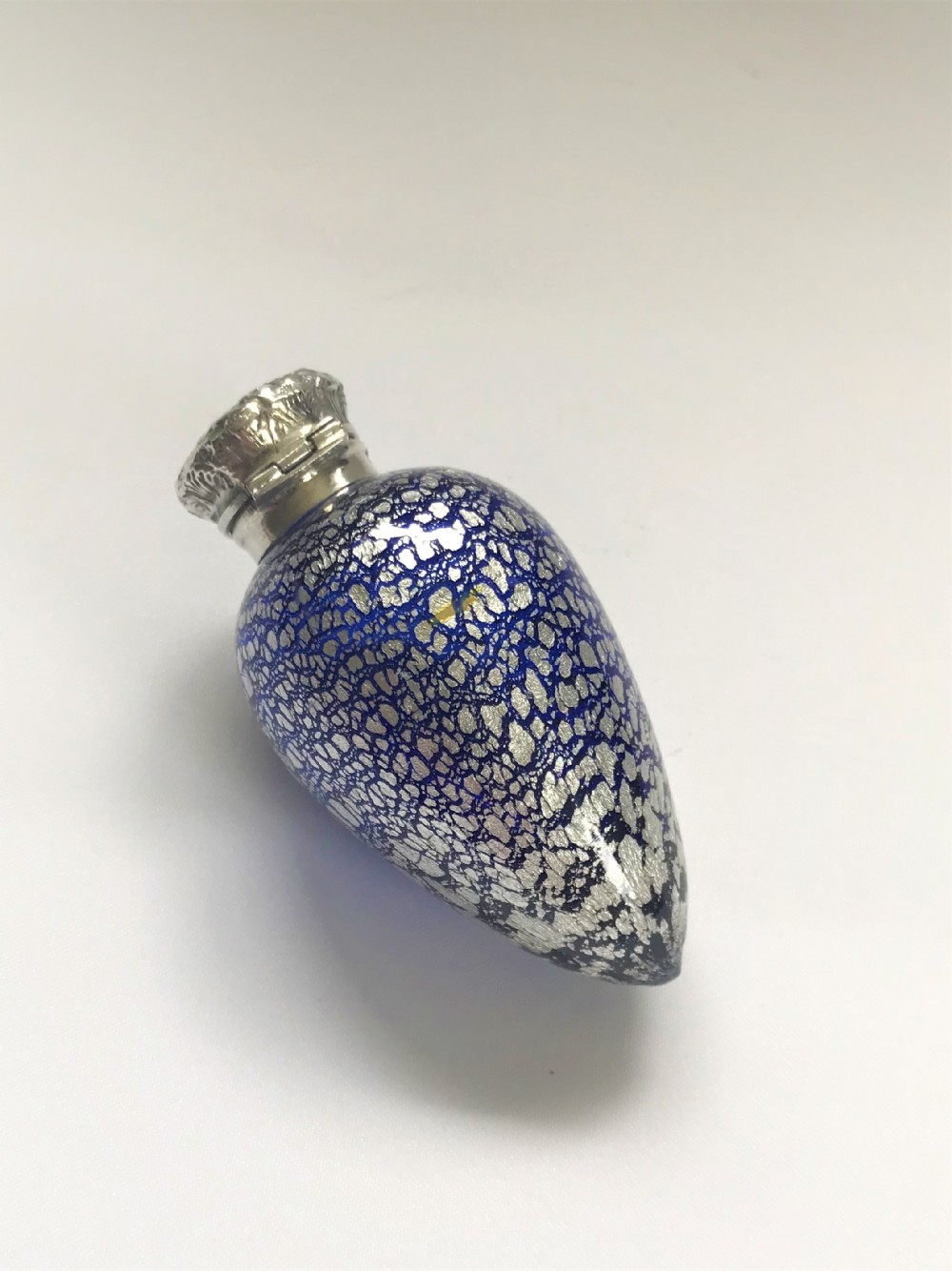 A spectacular silver mounted scent with silver leaf decoration