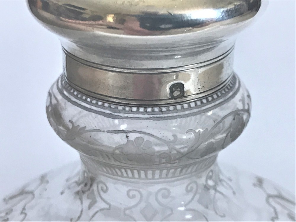A fabulous Baccarat silver mounted Moonflask decanter View V