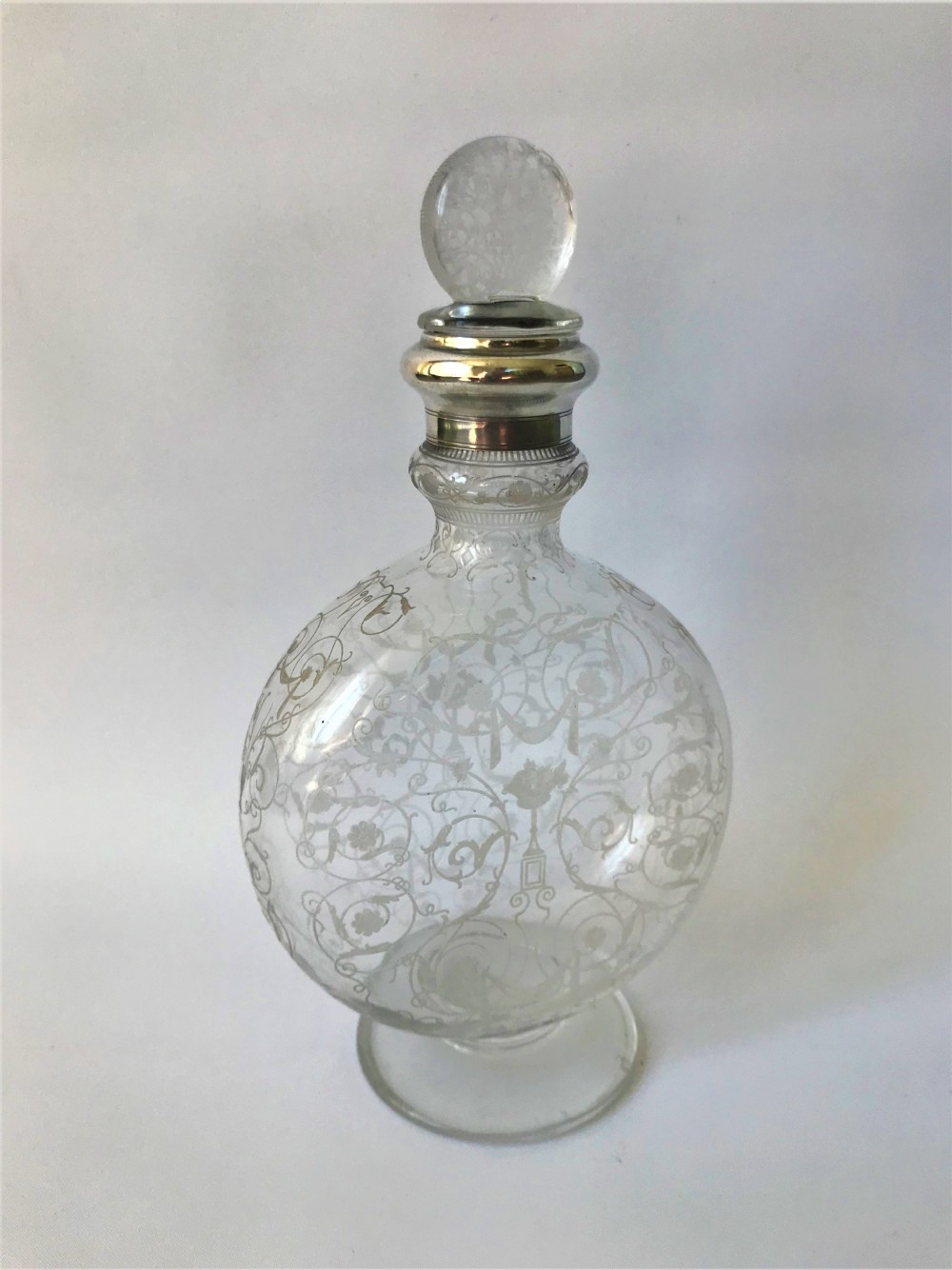 A fabulous Baccarat silver mounted Moonflask decanter