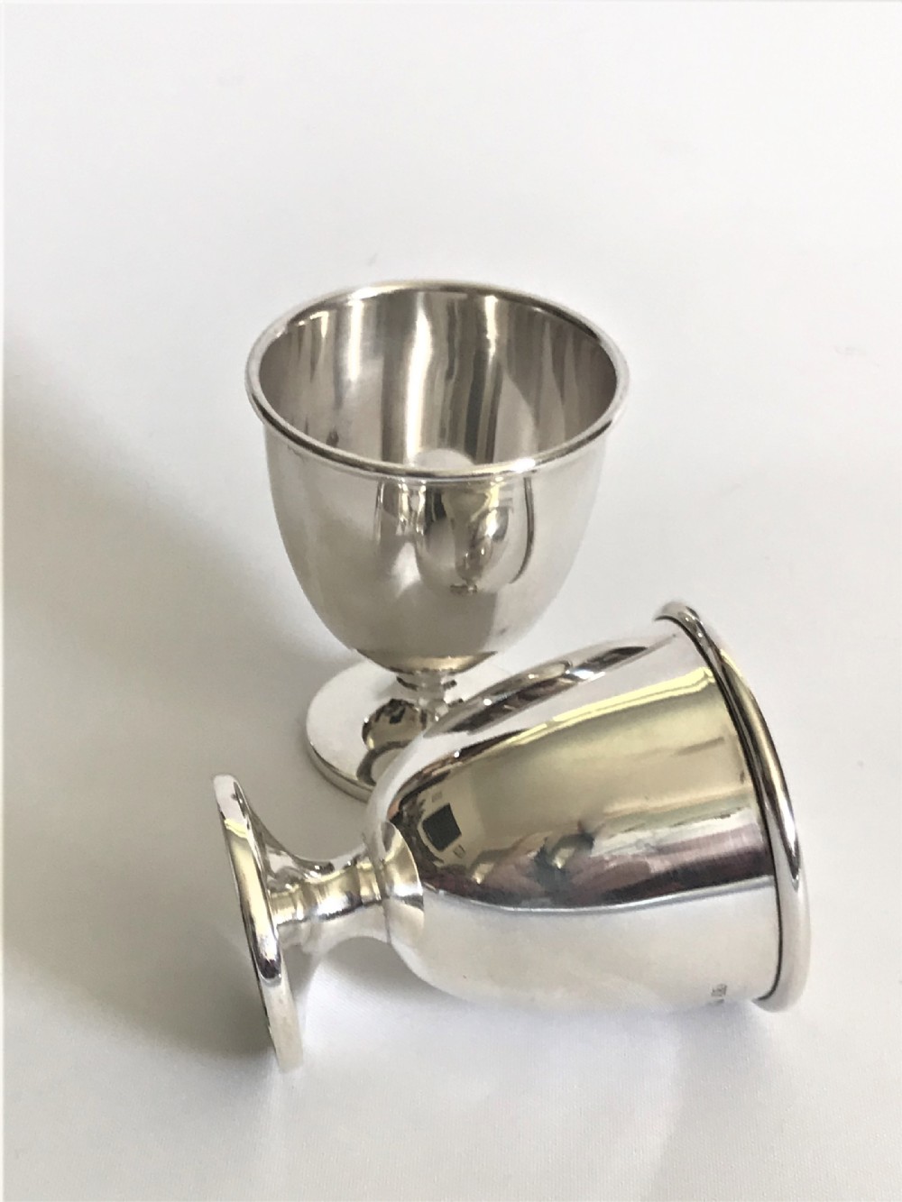 A delightful pair of twin silver egg cups