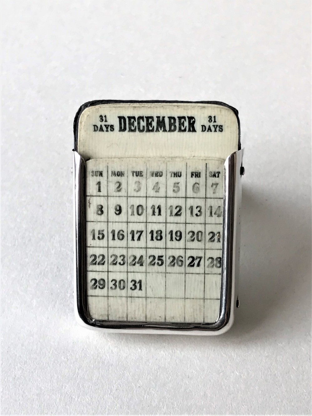 A Charming Miniature Silver Perpetual Calendar