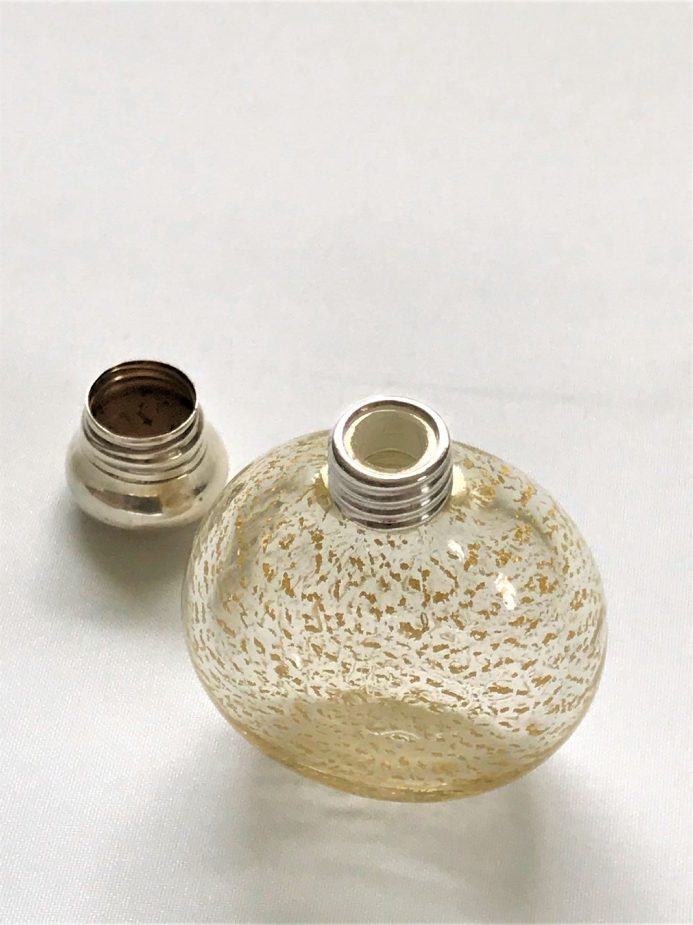 A gorgeous silver mounted gold leaf flecked scent bottle View III