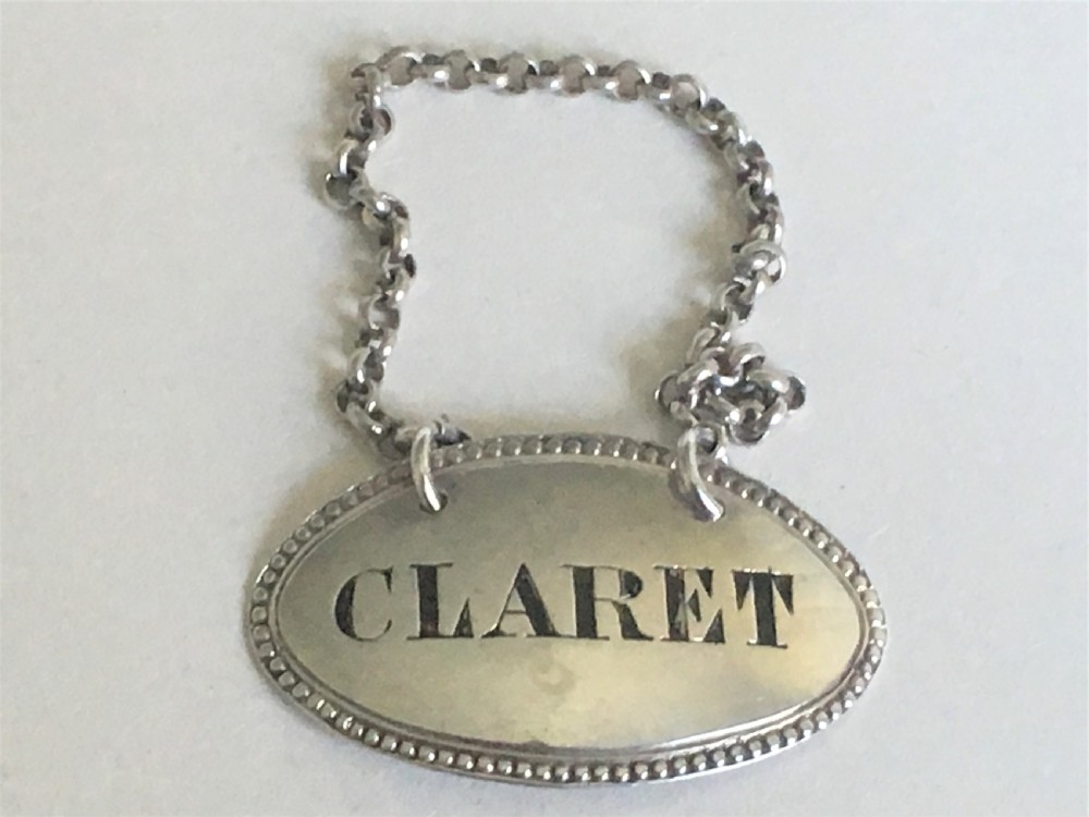 A handsome Victorian silver Claret label
